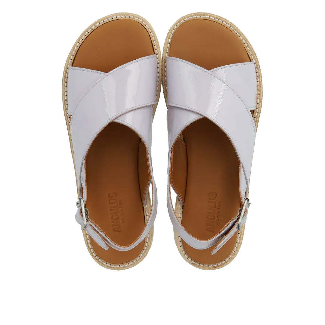 Cross sandal with buckle closure