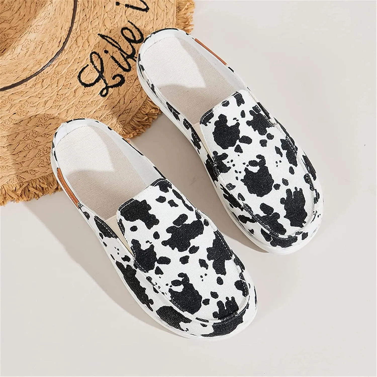 DOIX Women's Flat Mules Closed Toe Canvas Flat Clogs Sandals Backless Slip on Slides Loafer Shoes Garden Shoes Summer Boat Shoes Walking Slippers,Cow Print,US10/EU41